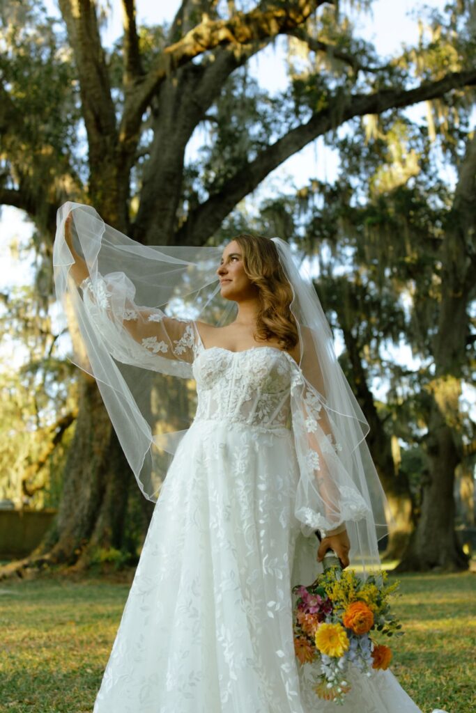 Satin wedding gown with cathedral veil