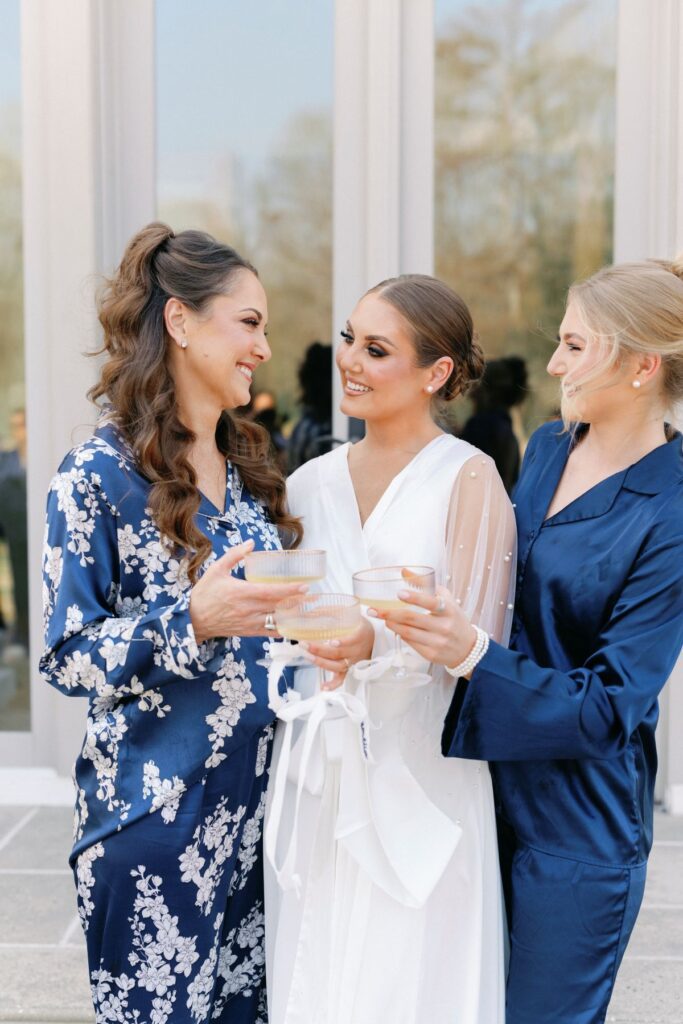 Soft coastal wedding guest updo with relaxed romantic texture