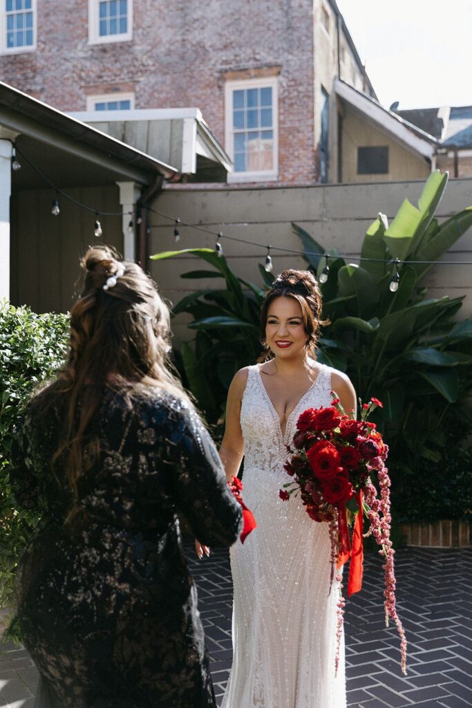 Elegant wedding guest updo decorated with delicate pearl hair accessories