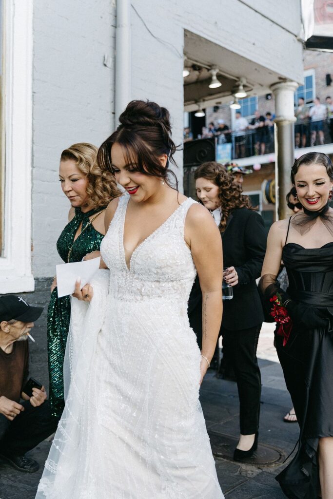 Voluminous low wedding guest updo for long and thick hair