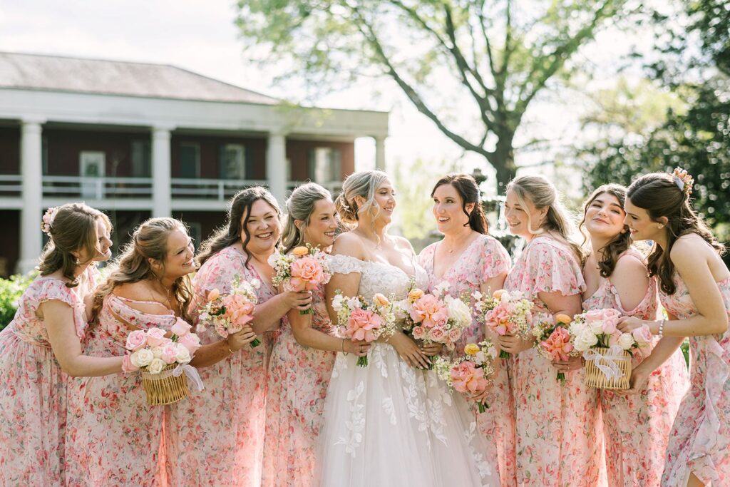Romantic wedding guest updo with loose curls framing the face