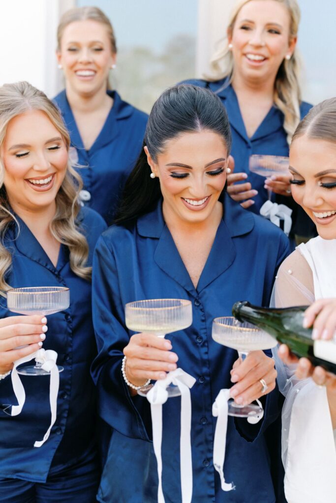 Elegant wedding guest updo paired with statement earrings